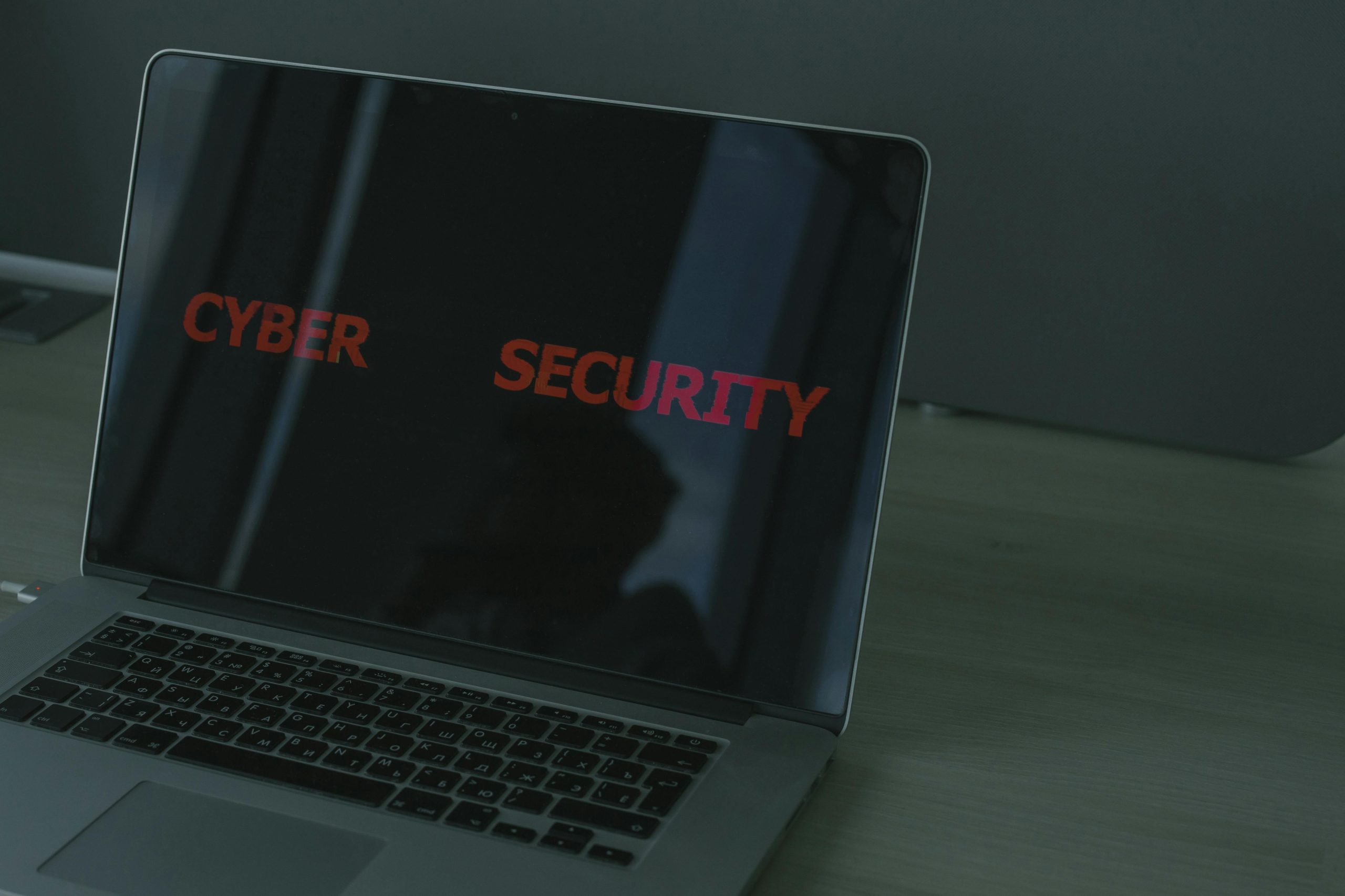 Laptop displaying the text Cyber Security on the screen - cybersecurity